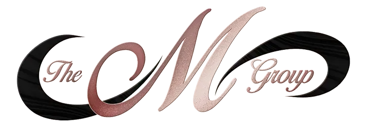 Stylized “The M Group” logo in black and rose script on a white background