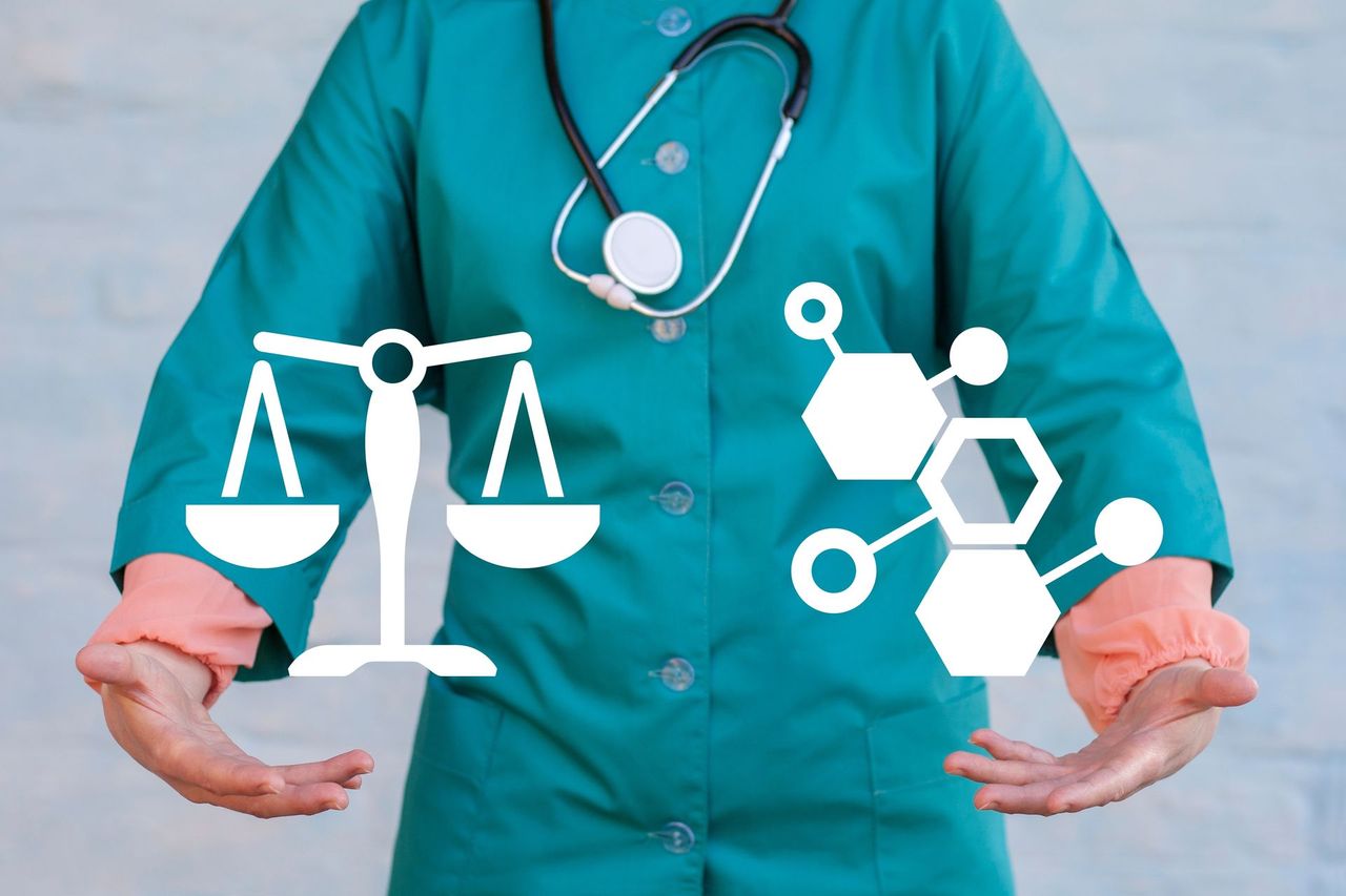 Doctor in green scrubs holding icons of legal scales and a molecule, symbolizing medical law and science